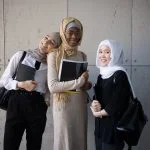 Positive Multiracial Muslim Women With Workbooks In University