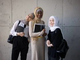 Positive Multiracial Muslim Women With Workbooks In University
